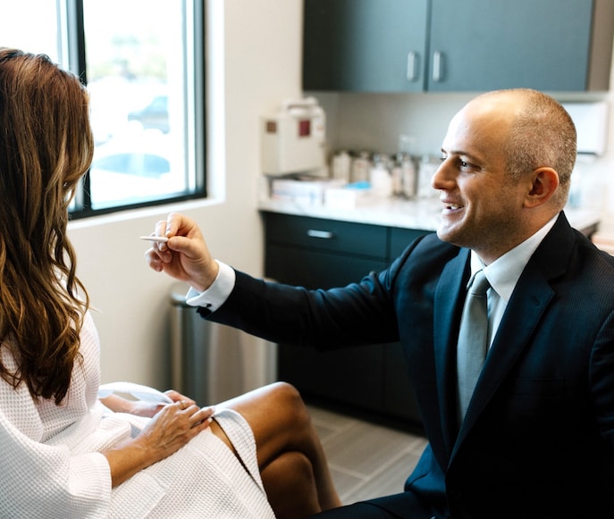 Dr. Geo N. Tabbal examining patient