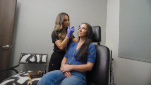A Botox injector performing the procedure on a patient.